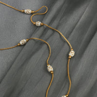 white bead necklace